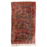 A Persian Tabriz 'Tree of Life' pattern rug, birds and florals on a red ground, floral border,