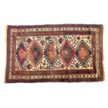 A Persian Yalameh rug, triple border and five colourful serrated lozenges, 213x125cm