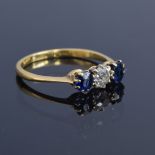 An 18ct gold, sapphire and diamond trilogy ring, size R, 2.5g