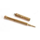 A Victorian gilt metal mechanical pencil, the case with foliate engraving, 5cm long extending to 8.