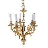 A late 19th century gilt metal five light hanging chandelier, later fitted for electricity,