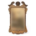 A 19th century Continental gilt gesso wall mirror, broken pediment with central shell cresting,