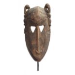 A Toussian Loniake/Mpie mask, Burkina Faso, carved wood, 35cm high