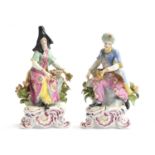 A pair of French 19th century porcelain figures of a couple in Ottoman dress, probably Samson,
