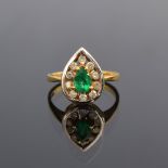 An 18ct gold emerald and diamond ring of teardrop form, the ten diamonds totalling approx. 1ct, size