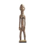 A Senufo maternity figure, carved wood, Ivory Coast, 66cm high