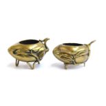 Two Chinese late 19th century gilt bronze peach censers, each raised on three feet modelled as