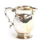 A large George III milk jug by Thomas Wallis I, London 1776, 13cm high, 11.5ozt