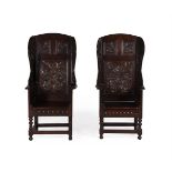 A pair of Victorian carved oak wing armchairs, in 17th century style, 148cm high, 74cm wide, 60cm