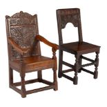 Two carved oak chairs in 17th century style, one open backed, the other with arms, 102cm and 101cm