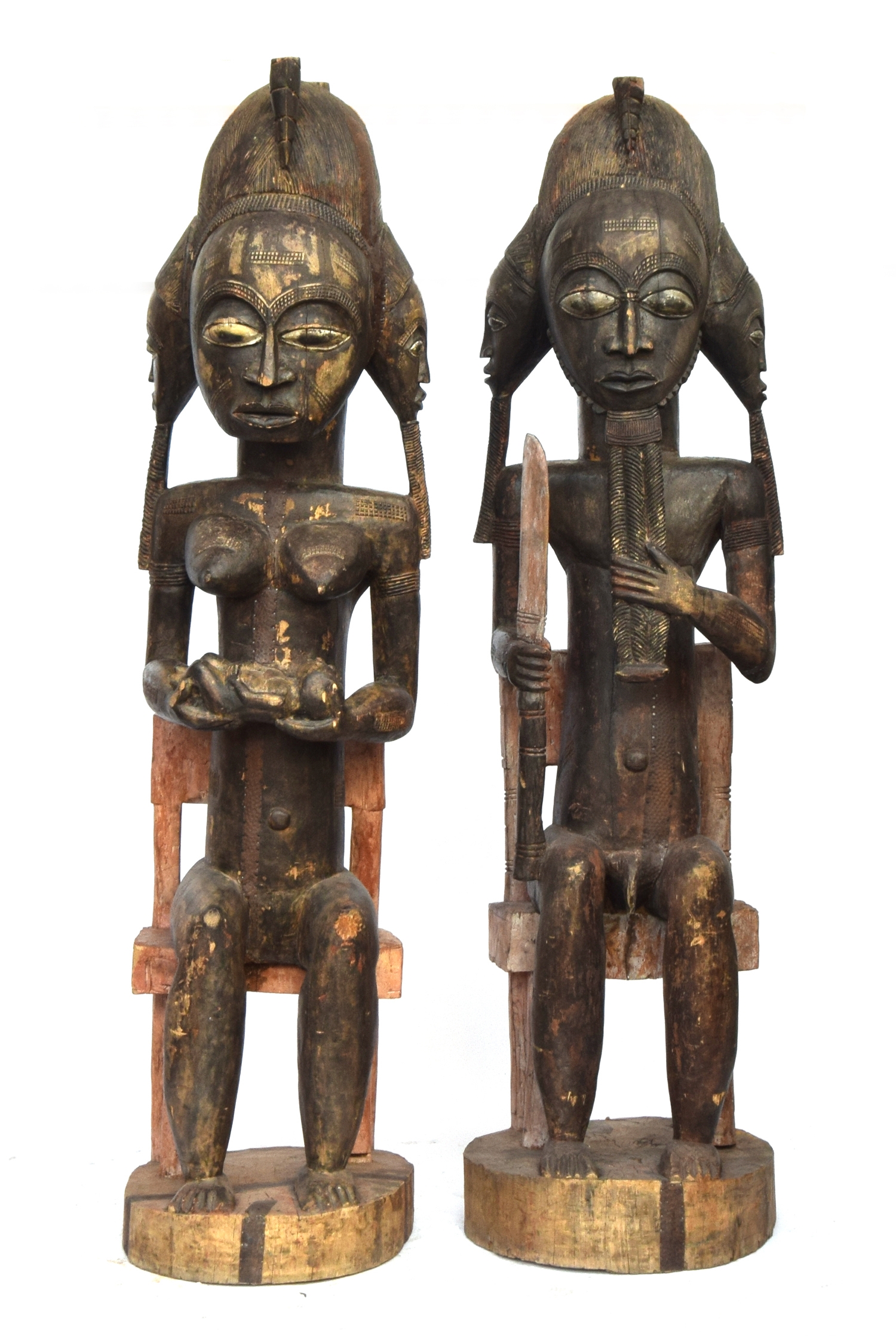 A pair of Senufo seated fertility figures, carved wood, Ivory Coast, 200cm high