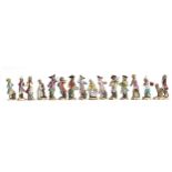 A set of fourteen 19th century Meissen monkey orchestra porcelain figurines (af), all 15cm and