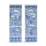 A pair of tall Chinese blue and white vases of square form, each of the four sides painted with