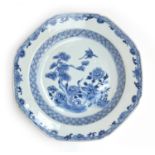 An 18th century Chinese export blue and white octagonal dish, decorated with a scene of cranes in