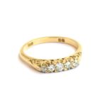 An 18ct gold and diamond five stone ring, size P, hallmarked for London 1919, 3.6g