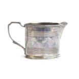 A Georgian silver milk jug, marks rubbed, cylindrical banded body, 5.5cm high, 2.6ozt