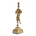 A heavy French gilt metal table lamp in the form of a putti with cornucopia, 61cm high to top of