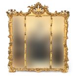 A Rococo Louis XV Chippendale style giltwood and gesso mirror, the C-scroll cresting adorned with