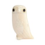 Donald Ungott (1935-2002) an owl figurine caved from walrus tusk with double inlaid eyes, 5.5cm high