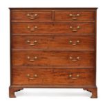 A large George III mahogany chest of two short over four graduating drawers, on bracket feet,