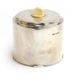 An Art Deco silver biscuit barrel by Hukin & Heath Ltd, Birmingham 1932, of cylindrical form on four