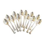 A set of 12 George III King's Pattern dessert spoons, eight by William Eley & William Fearn,