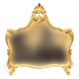 A gilt gesso shaped wall mirror, 20th century, 92cm wide, 99cm high