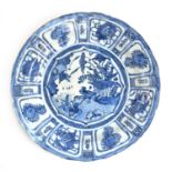 A Chinese blue and white porcelain dish in the kraak style, the scene depicting a bird surrounded by