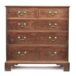 A George III mahogany chest of two short over three graduating drawers, on bracket feet, 104cm wide,