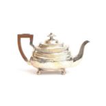 A George III silver teapot by William Welch II, Exeter 1814, of banded rectangular form with harp