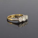 An early 20th century 18ct gold and platinum diamond trilogy ring, total diamond weight approx. 0.