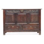 An 18th century oak three panel mule chest, panelled sides, 127cm wide, 55cm deep, 83cm high