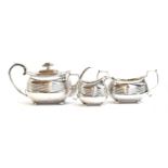 A three piece silver teaset by Thomas & George Hayter, London 1817, of banded rectangular form,