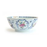 A Chinese porcelain bowl, blue and white with panels depicting flowers and courtesans heightened