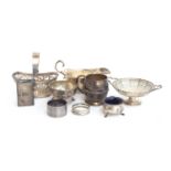 A mixed lot of silver items to include a George V gravy boat by Robert Pringle & Sons, Birmingham