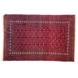 A red ground Turkmen rug, 187x125cm