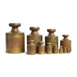 A large set of 19th century brass assay weights, from 500 troy oz down to 2 troy oz