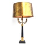 A gilt metal four arm candelabra table lamp, with single electrical fitting, on a square tapered