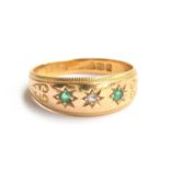 An Edwardian 18ct gold emerald and diamond gypsy ring, hallmarked for Birmingham 1905, size P 1/2,
