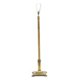 An early 20th century heavy brass standard lamp, adjustable height, on a square stepped weighted