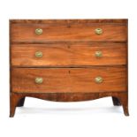 A Regency mahogany bowfront chest of drawers, the crossbanded top over three graduating drawers,