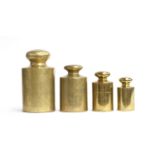 A set of four large 19th century brass weights, the largest marked Vandome London, measuring 2000,