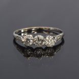 An 18ct white gold diamond trilogy ring, illusion shoulders, the total diamond carat weight