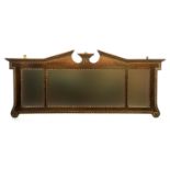 A Georgian revival mahogany and giltwood overmantel mirror, broken pediment with all round egg and