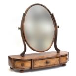 A 19th century mahogany, line inlaid, and burr adjustable oval box mirror, with three drawers below,