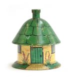 An early Tunbridge ware white wood paint decorated cottage form string box, of circular form painted