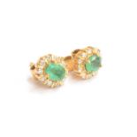 A pair of 18ct gold, emerald and diamond stud earrings, 0.7cm long, gross weight 3.2g