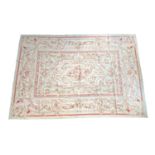 A very large French Aubusson style floral rug, rose swag design, 427x300cm