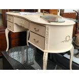 A white painted kidney shaped dressing table with three drawers, 132cmW