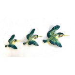 A set of three Beswick flying kingfisher wall plaques, numbered 729-1, 729-2 and 729-3, the